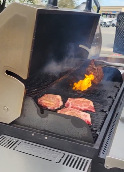 Recteq pellet grill with pork chops and burgers