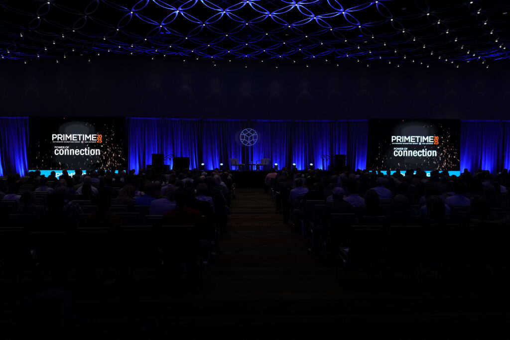 Dark auditorium filled with people