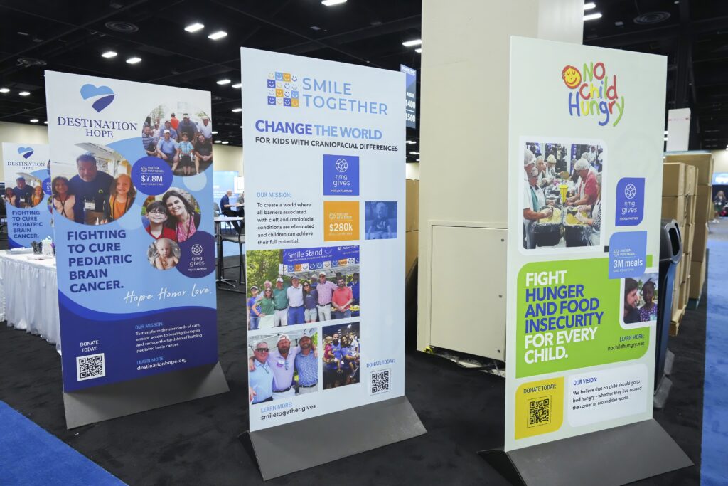 Three banner signs at an expo booth