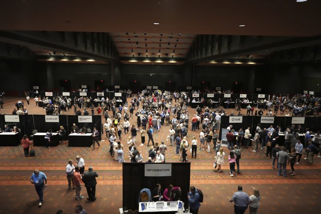 Aerial view of large room with people gathered