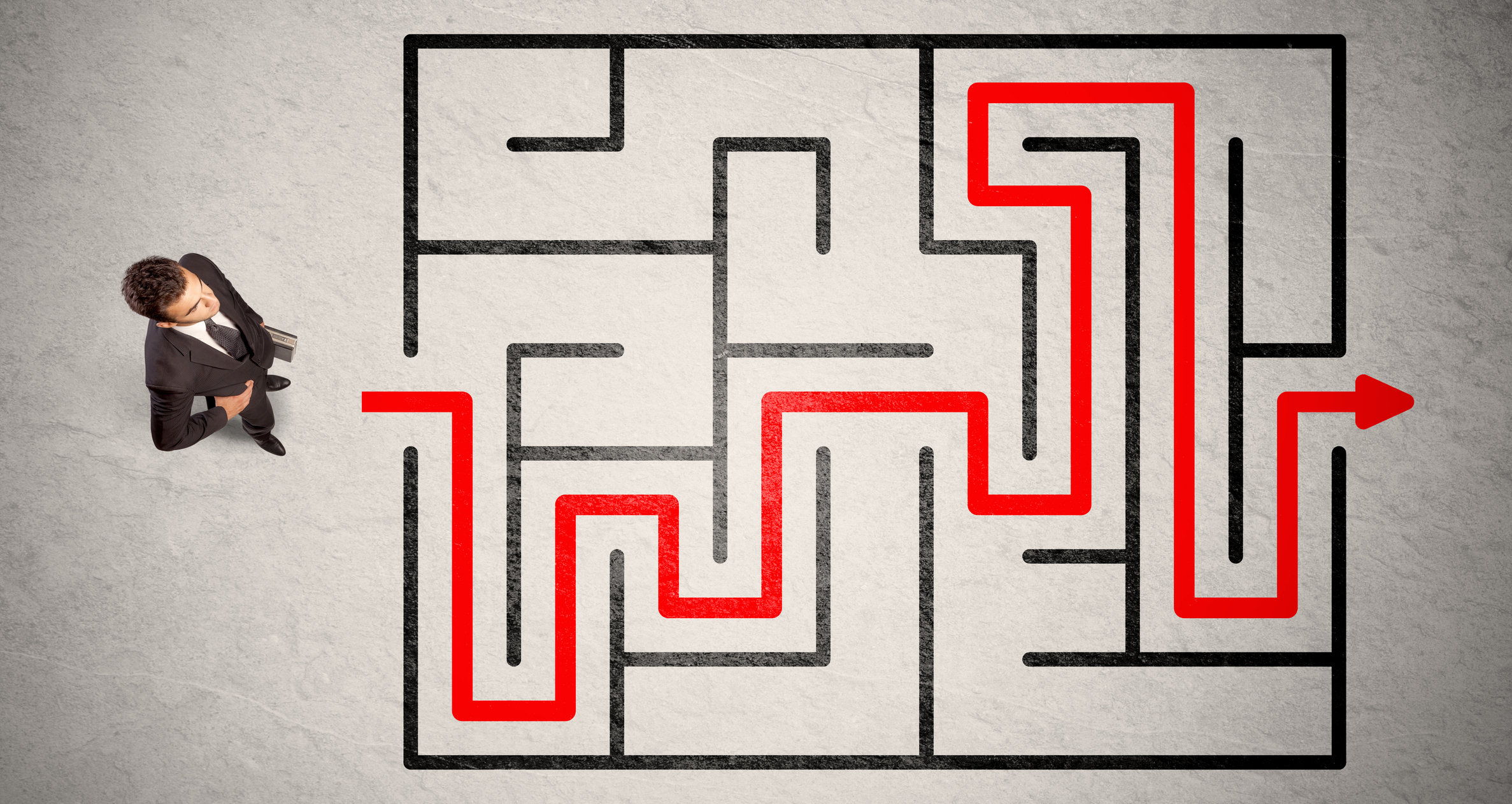 Lost businessman found the way in maze with red arrow
