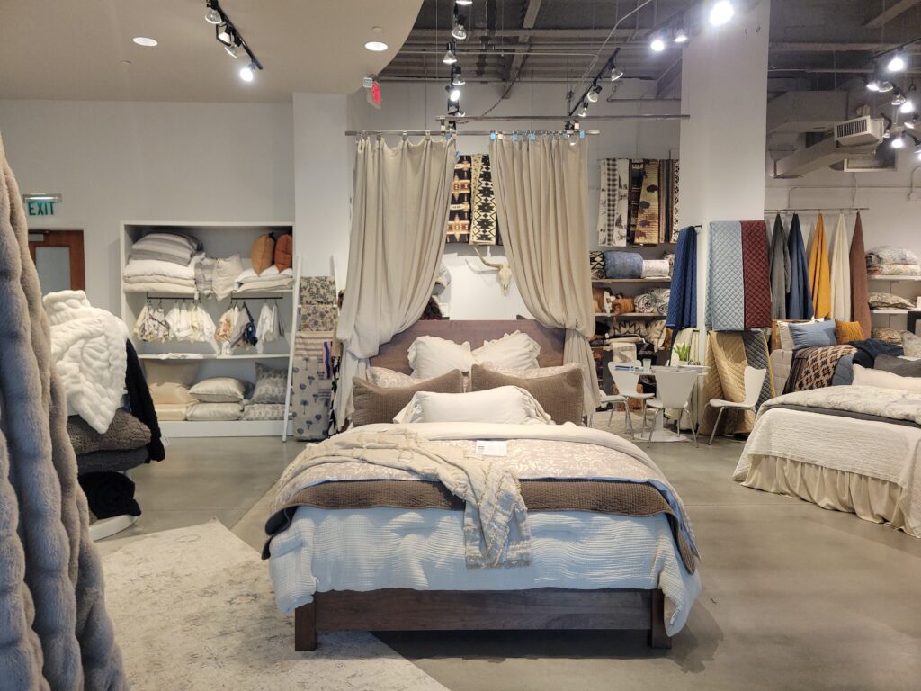 Fully dressed bed in a furniture showroom
