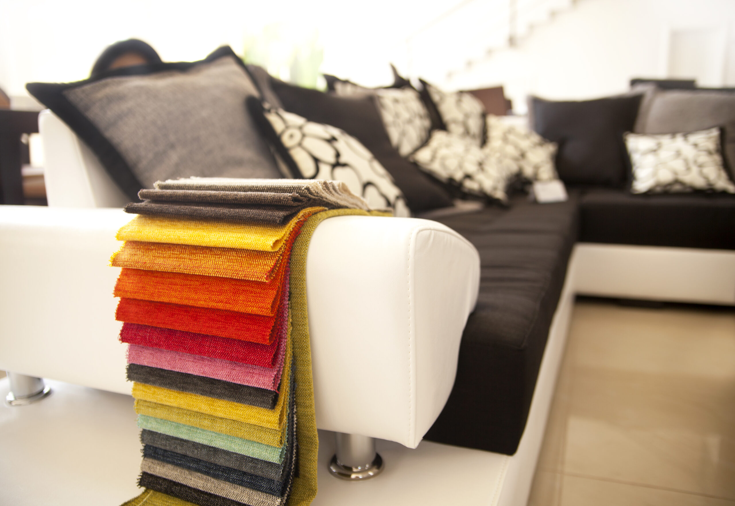 Sofa with fabric swatches on the arm