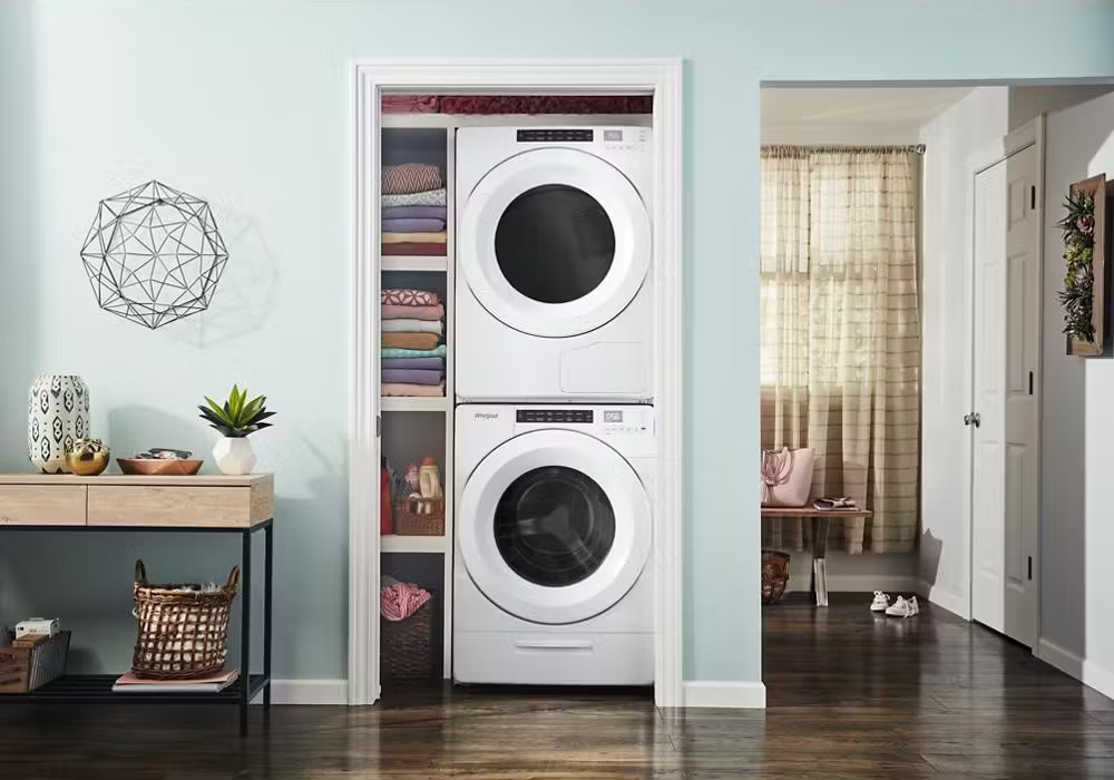 Stacked washer dryer in home