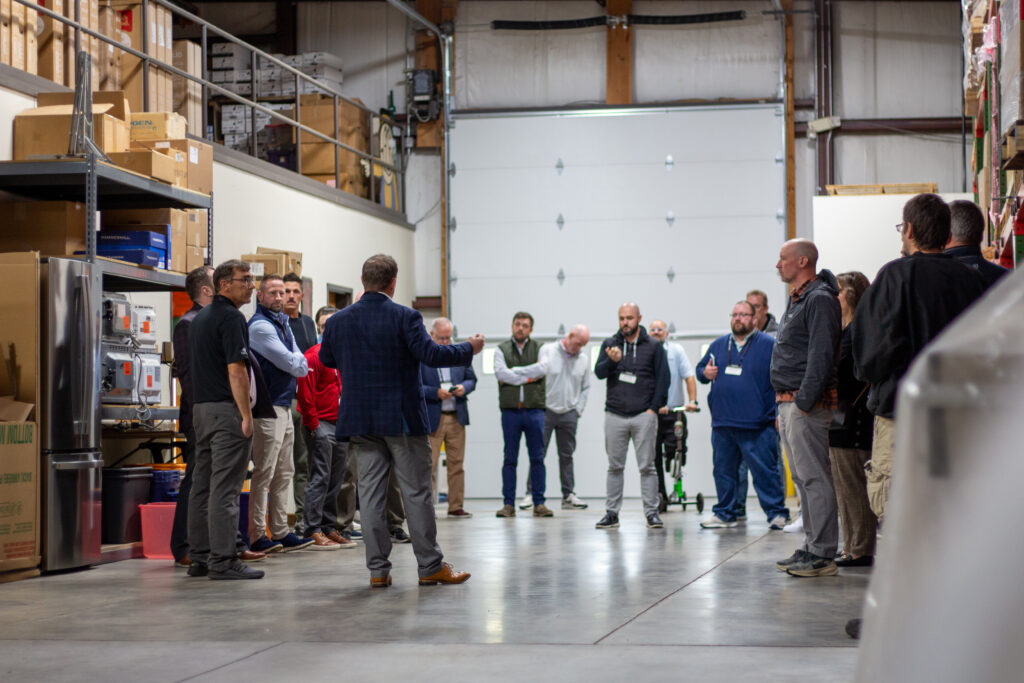 Group of people touring a warehouse