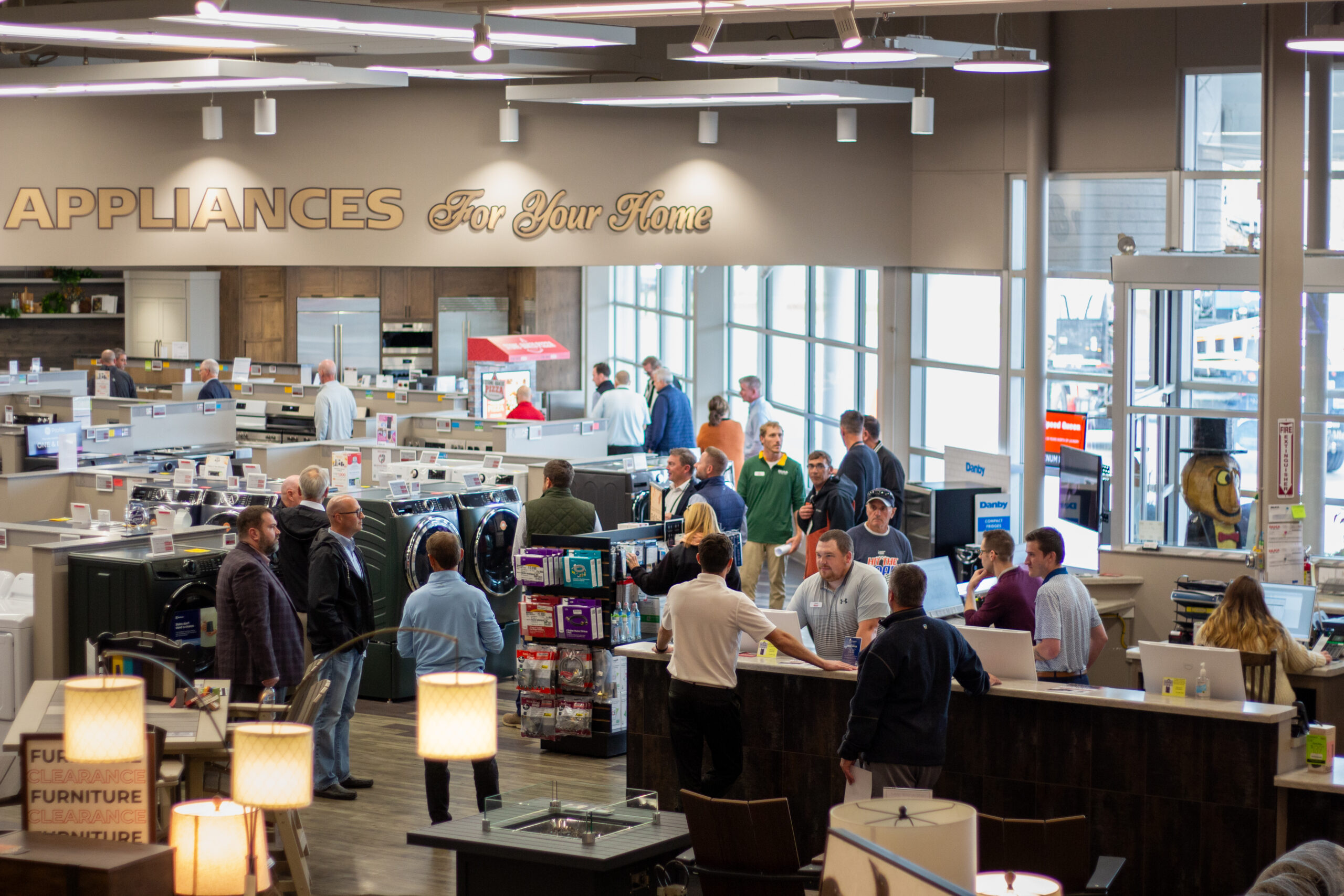 Silica 2025 – Store Visit 3 Group of people in a retail showroom