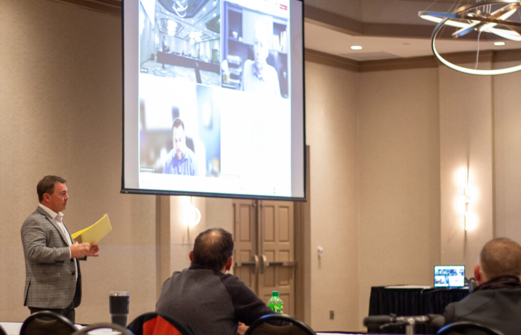 Man giving a presentation in front of an audience