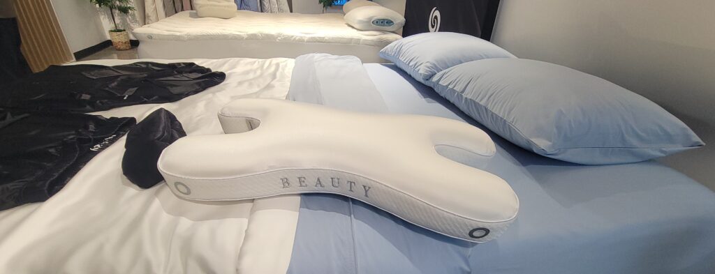 silk beauty pillow on a bed in a showroom
