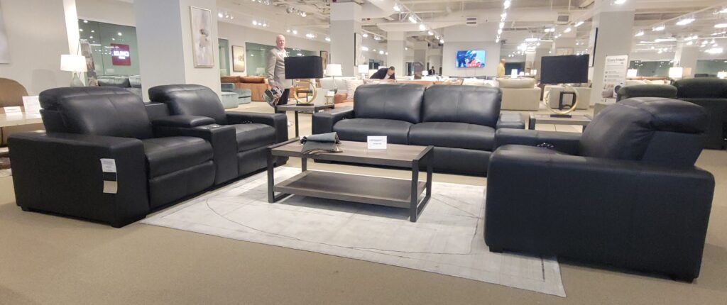 Black leather living room set in a showroom